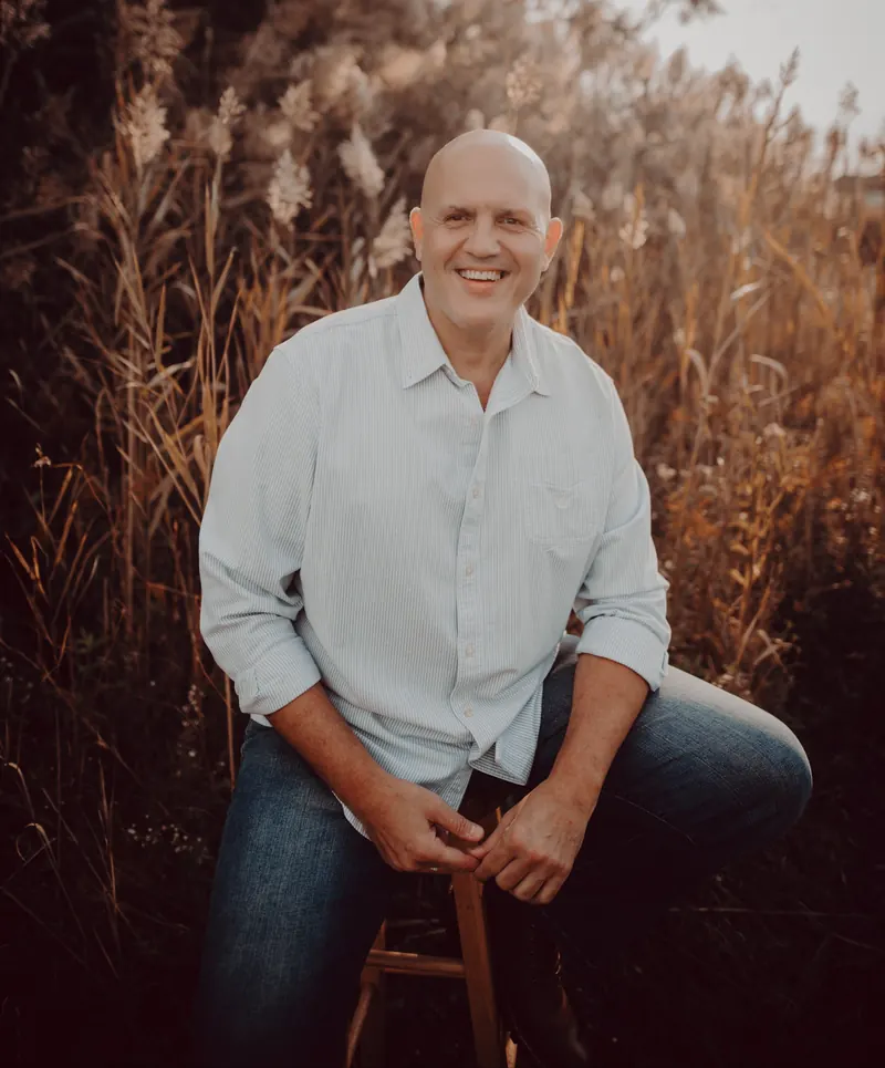 Joe Ortiz, Founder and Lead Interventionist of Transcend Interventions, seated outdoors in natural light